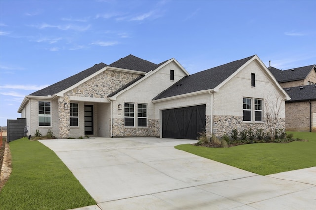 view of front of home featuring a garage and a front lawn