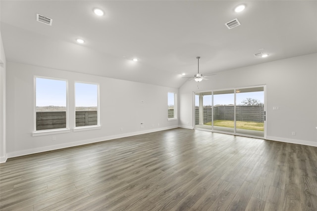 spare room featuring ceiling fan, lofted ceiling, and dark hardwood / wood-style flooring