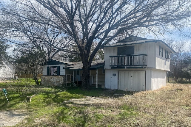 back of property featuring a balcony