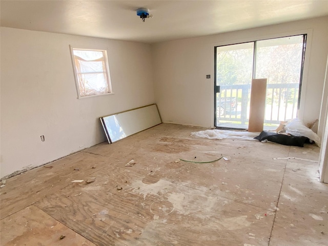 unfurnished room featuring a healthy amount of sunlight