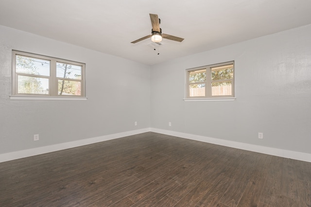 unfurnished room featuring ceiling fan and dark hardwood / wood-style flooring