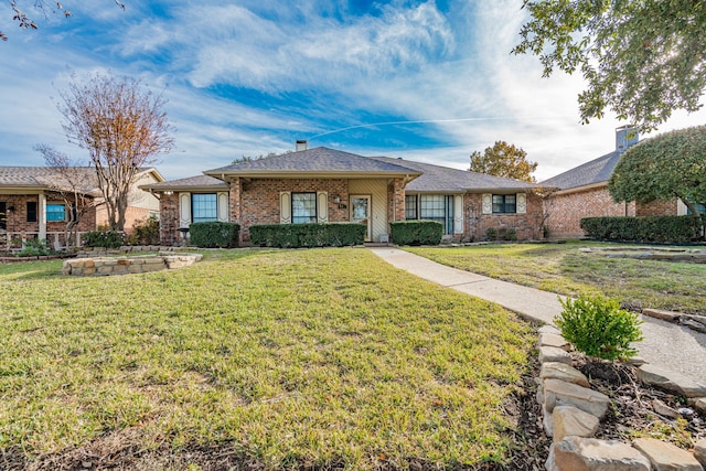 ranch-style house featuring a front lawn