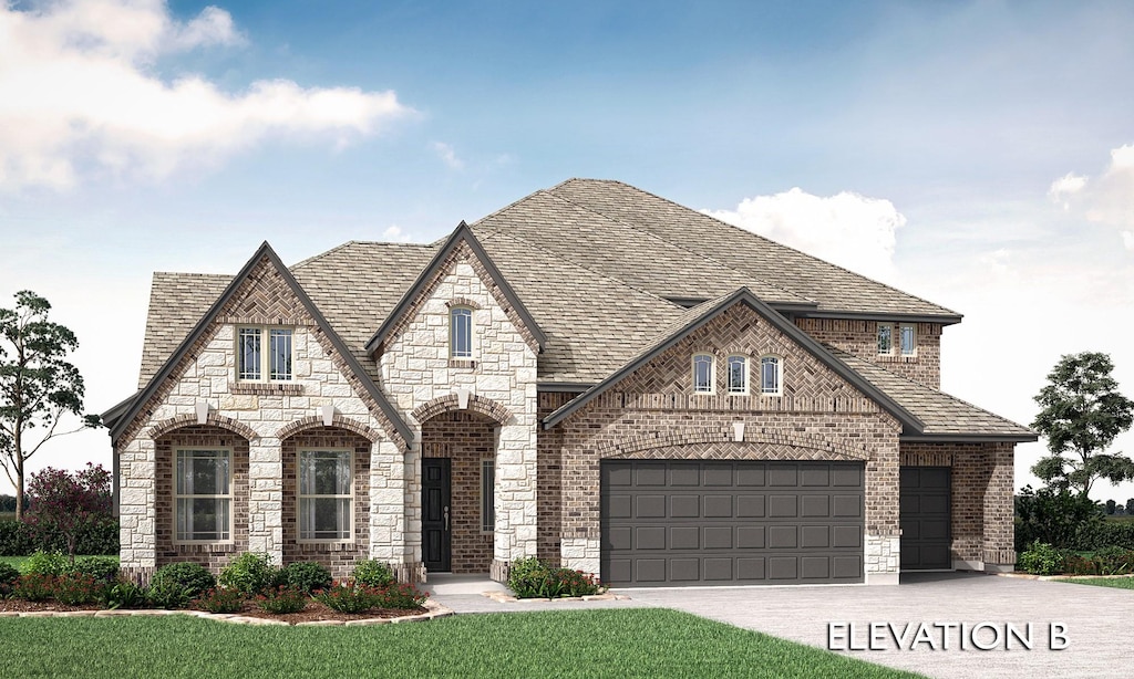 view of front of home featuring a garage and a front lawn