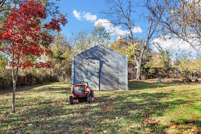 view of outbuilding featuring a lawn