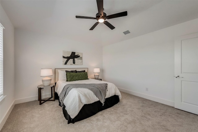 bedroom with ceiling fan and light colored carpet