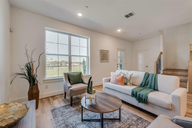 living room with light hardwood / wood-style floors