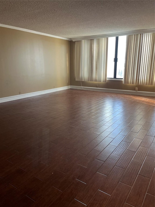 spare room with a textured ceiling, dark hardwood / wood-style flooring, and ornamental molding