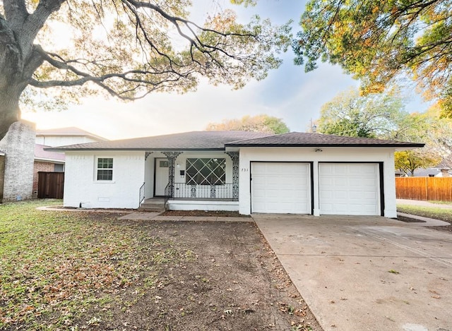 ranch-style house with covered porch and a garage