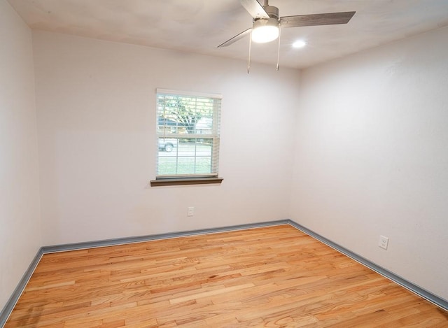 unfurnished room with ceiling fan and light hardwood / wood-style flooring