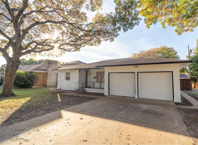 single story home featuring a garage