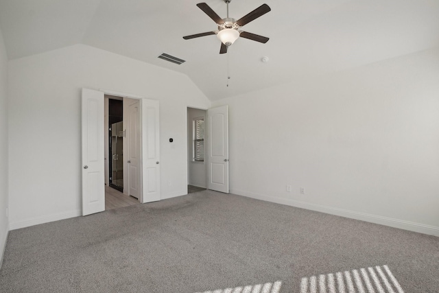 unfurnished bedroom with ceiling fan, light carpet, and lofted ceiling