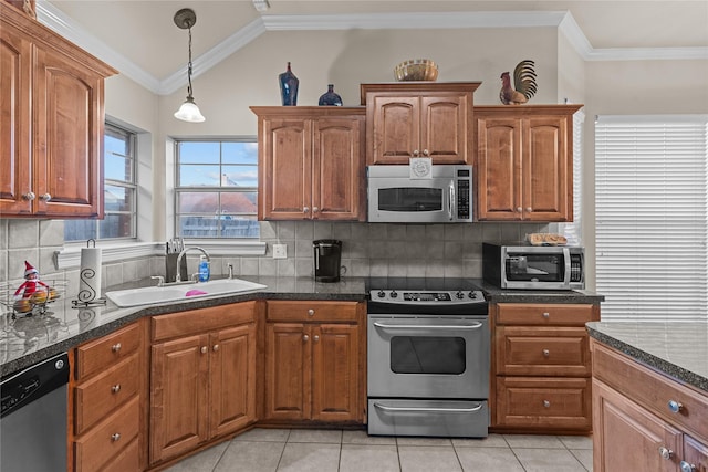 kitchen featuring sink, decorative backsplash, ornamental molding, appliances with stainless steel finishes, and light tile patterned flooring