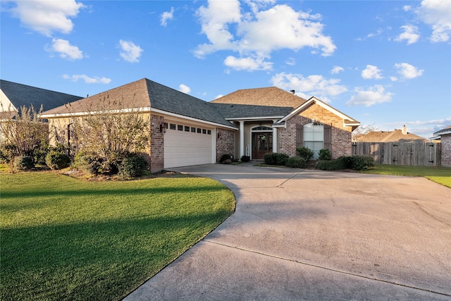 single story home featuring a front yard and a garage