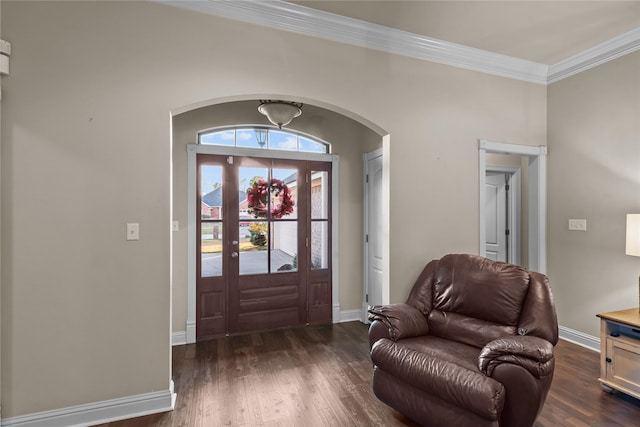 foyer with dark hardwood / wood-style floors and ornamental molding