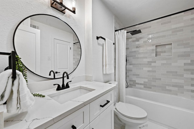 full bathroom with vanity, shower / bath combination with curtain, and toilet