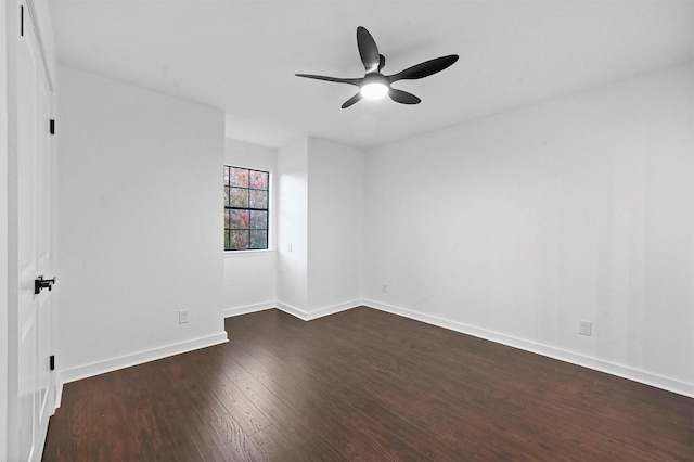 unfurnished room featuring ceiling fan and dark hardwood / wood-style flooring