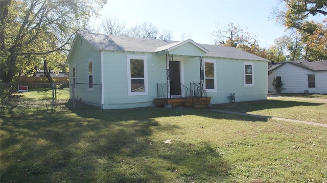 bungalow-style house with a front lawn