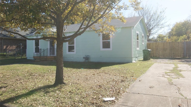 view of home's exterior with a yard