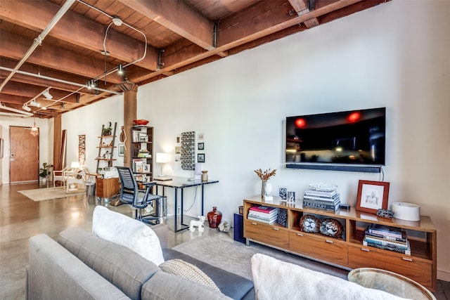 living room with beam ceiling, wooden ceiling, and concrete flooring