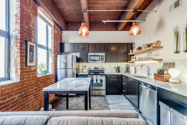 kitchen with wood ceiling, stainless steel appliances, hanging light fixtures, beam ceiling, and sink