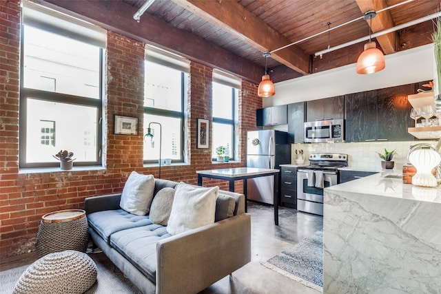 living room with brick wall, beam ceiling, and wood ceiling