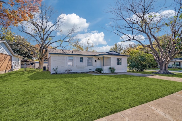 single story home featuring a front lawn and central air condition unit