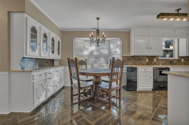 dining space with crown molding, sink, and a notable chandelier