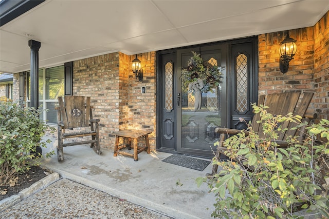 property entrance with covered porch