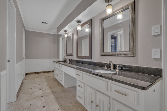 bathroom with vanity and ornamental molding