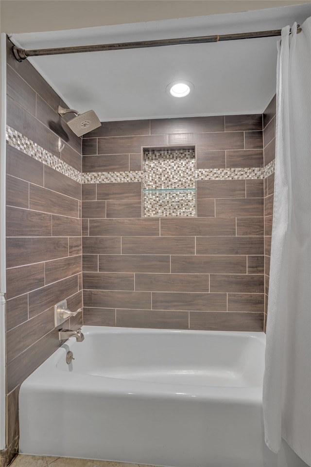 bathroom with shower / bath combo with shower curtain