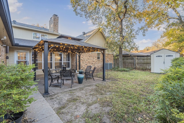 exterior space featuring a gazebo, a storage shed, and central air condition unit