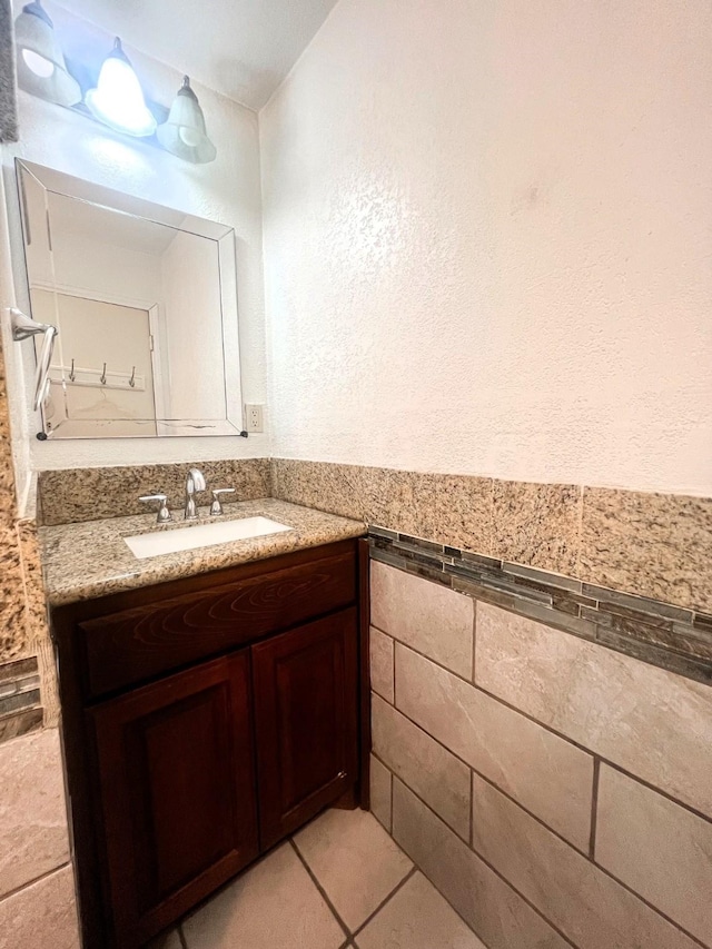 bathroom with tile patterned floors and vanity