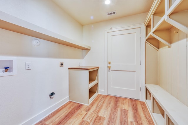 laundry room featuring washer hookup, light hardwood / wood-style floors, and electric dryer hookup