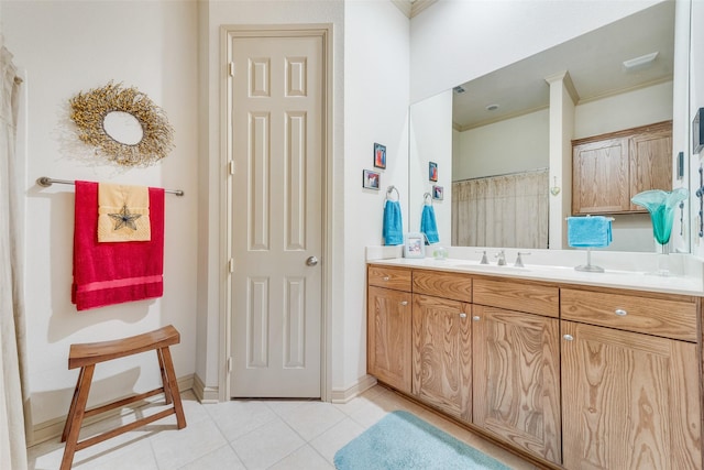 bathroom with vanity, crown molding, and tile patterned floors