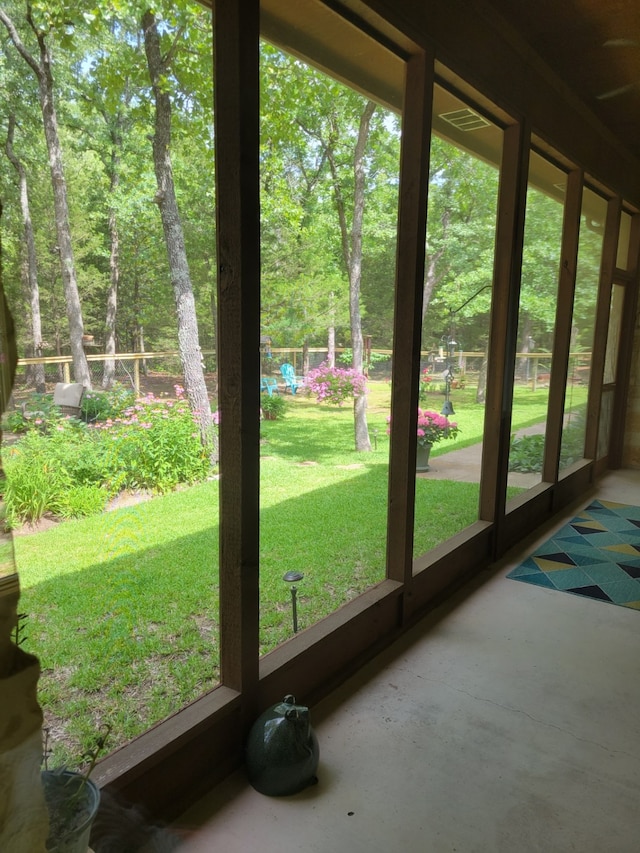 doorway to outside with concrete floors