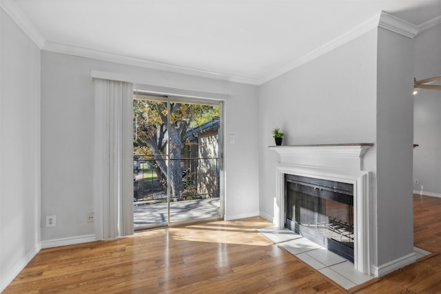 unfurnished living room with crown molding and light hardwood / wood-style flooring