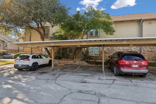 view of parking / parking lot featuring a carport