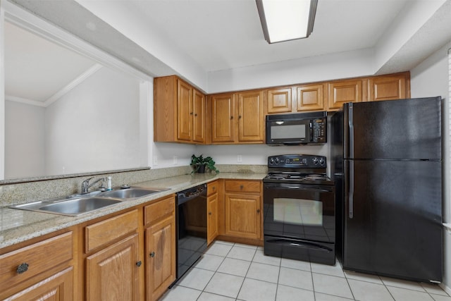 kitchen featuring black appliances, crown molding, light tile patterned floors, and sink