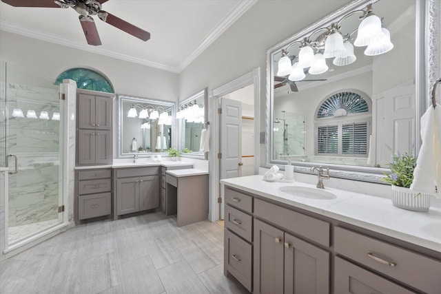 bathroom with vanity, ceiling fan, crown molding, and a shower with shower door