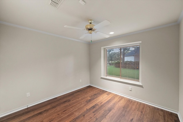 unfurnished room with wood finished floors, ceiling fan, baseboards, ornamental molding, and visible vents