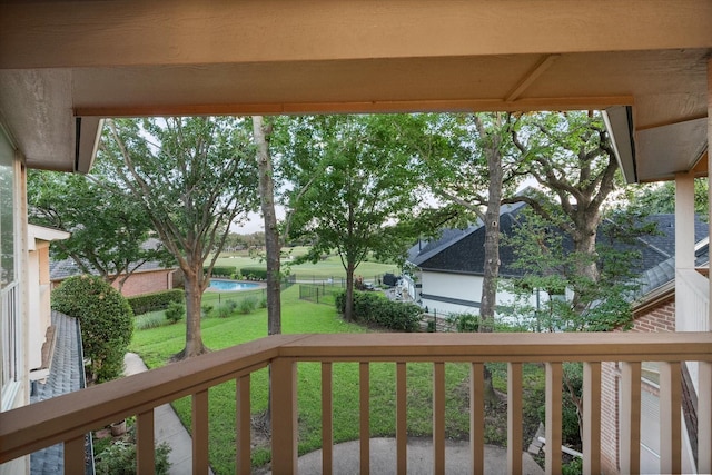 wooden deck with a lawn