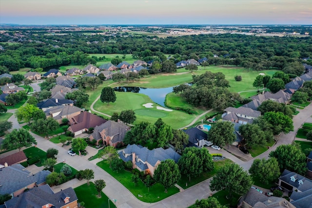 aerial view at dusk with a water view