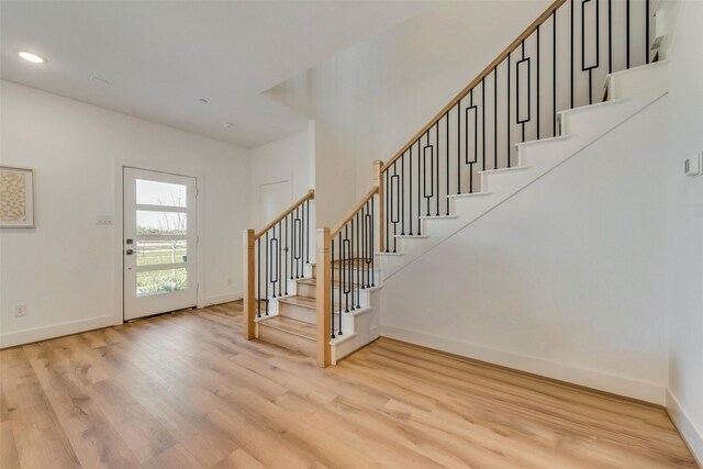 foyer with light hardwood / wood-style floors