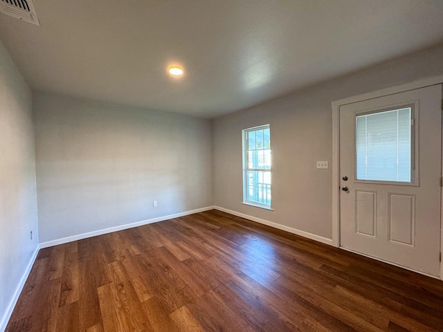 entryway with dark hardwood / wood-style floors