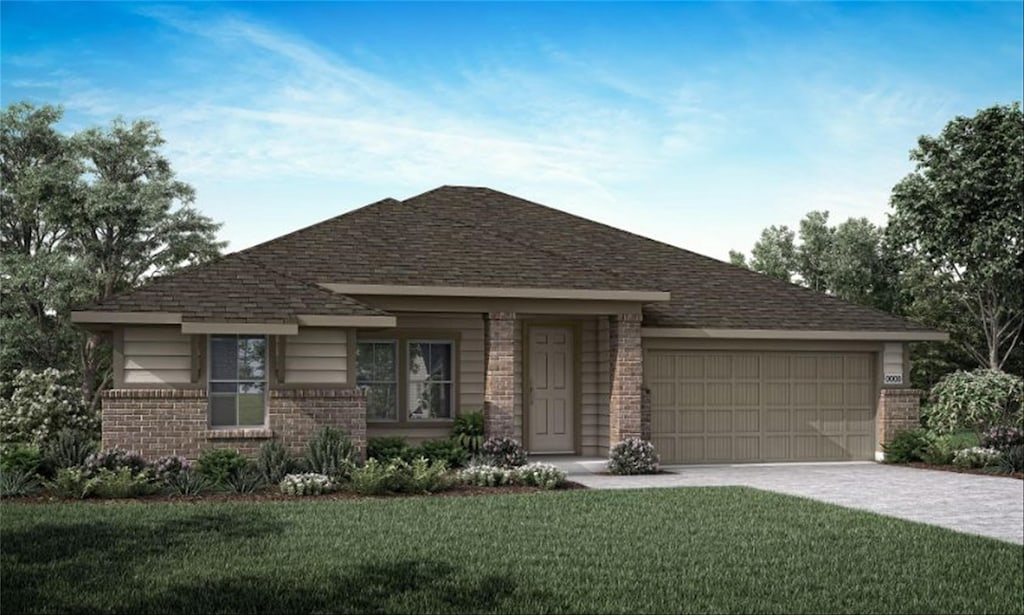 view of front of house with a garage and a front yard