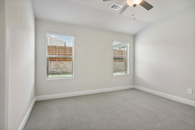 752 Poppy Ln, Lavon, TX 75166 - empty room with carpet, baseboards, visible vents, ceiling fan, and vaulted ceiling