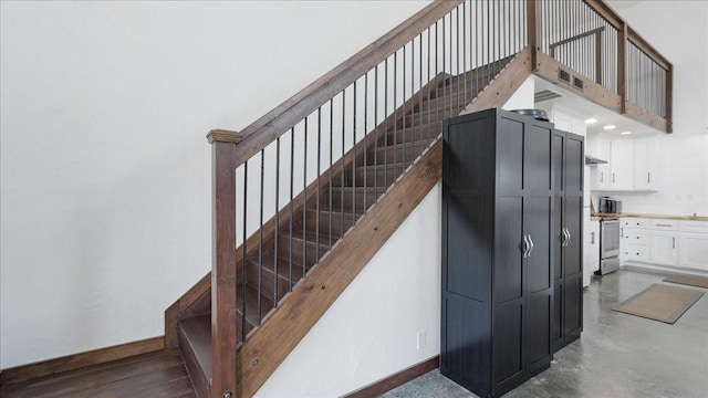 stairway with concrete floors