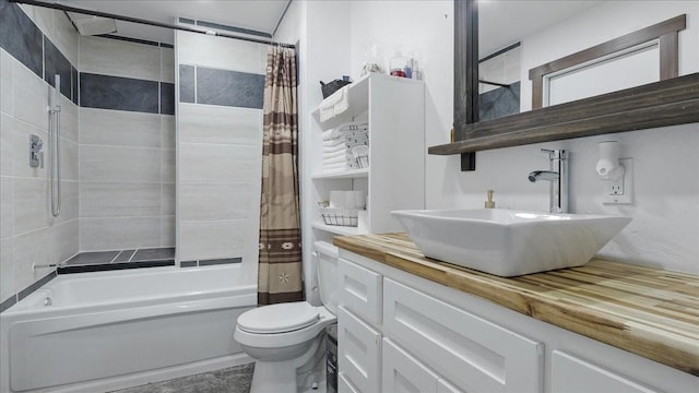 full bathroom with shower / bath combination with curtain, vanity, and toilet