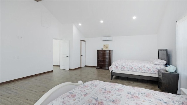 bedroom with a wall mounted AC, high vaulted ceiling, and dark hardwood / wood-style floors