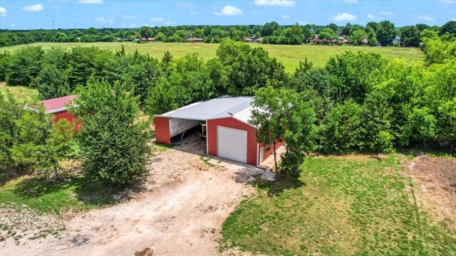 birds eye view of property with a rural view